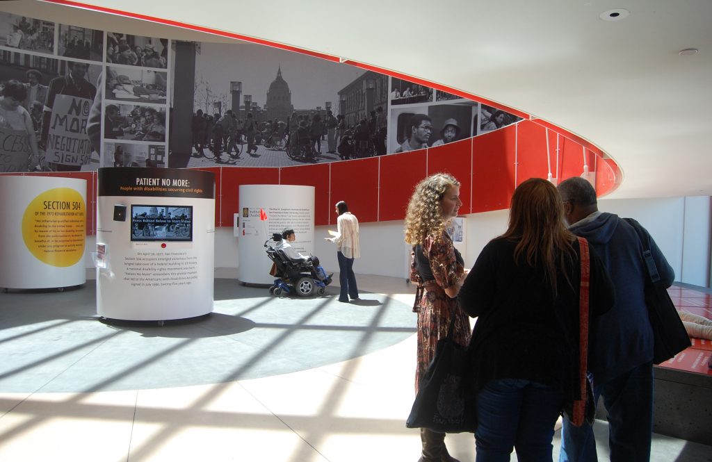 A view of the Rotunda at the Ed Roberts Center, with mural in the background