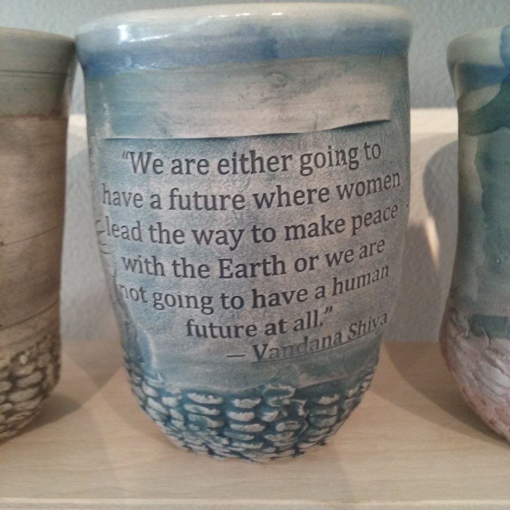 Matt cup with text impressed in We are either going to have a future where women lead the way to make peace with the earth or we are not going to have a future at all."